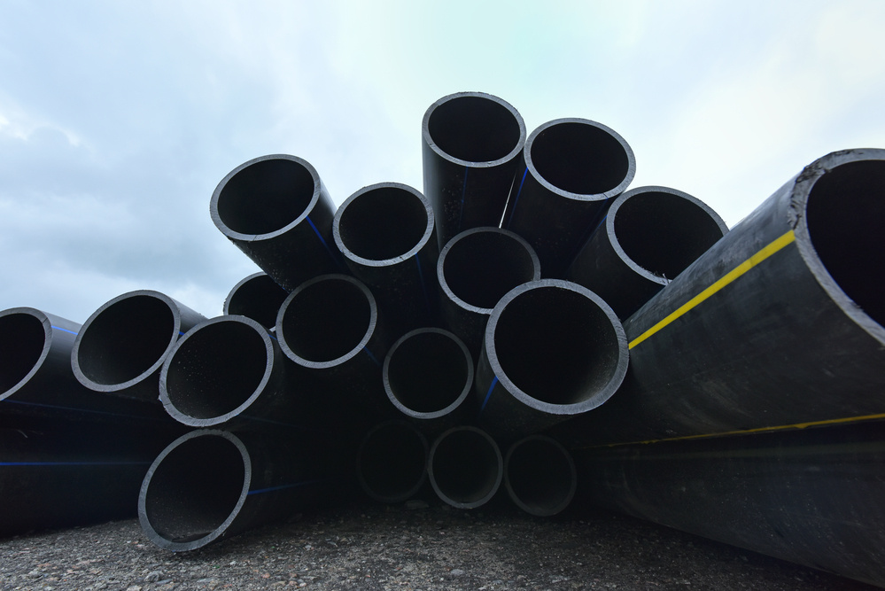 Close-up view of large-diameter HDPE pipes used for water distribution and wastewater management.