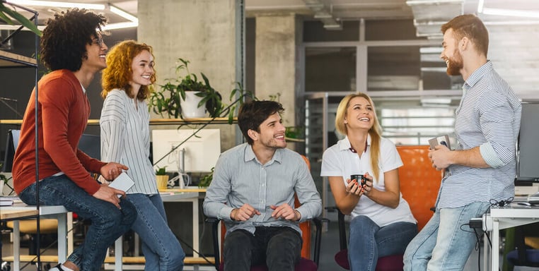 happy employees hanging out in a work environment