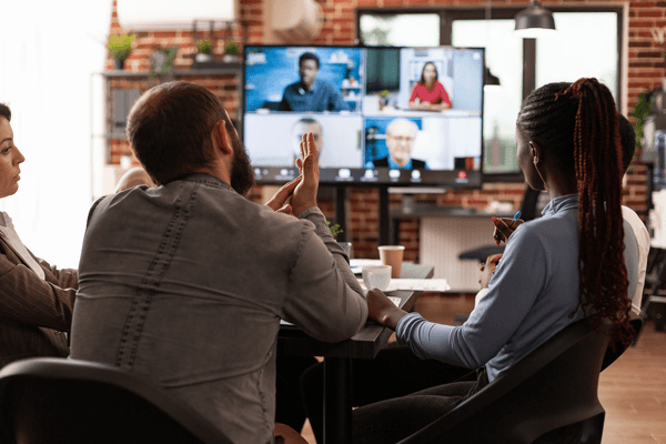 group of employees having a virtual video call meeting